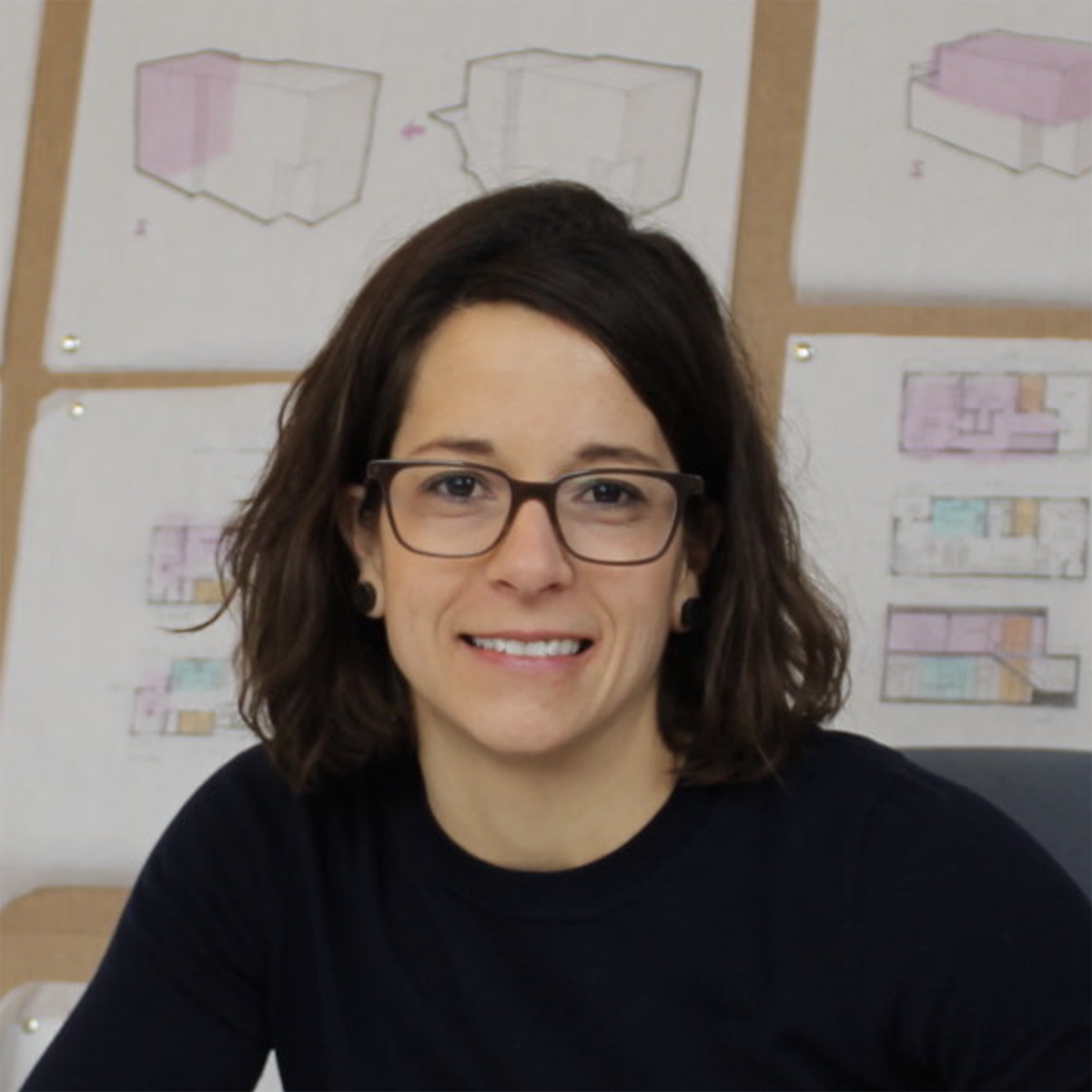 Headshot Chatham University interior architecture alumna with short brown hair and glasses.