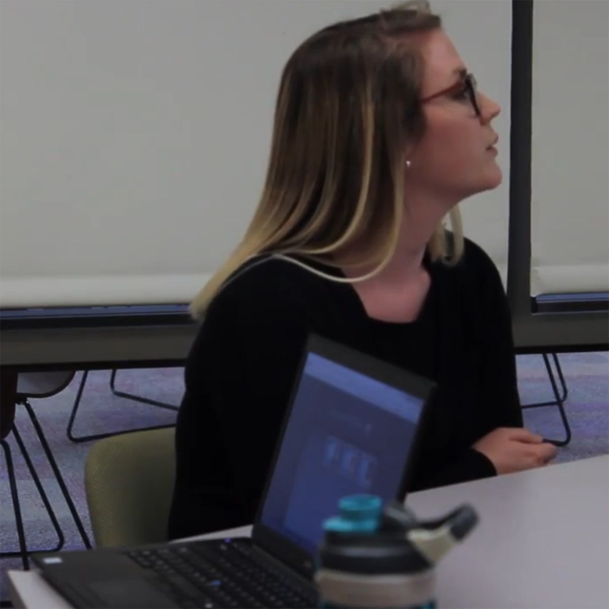 Photo of a PBL classroom session, with students seated together around a table